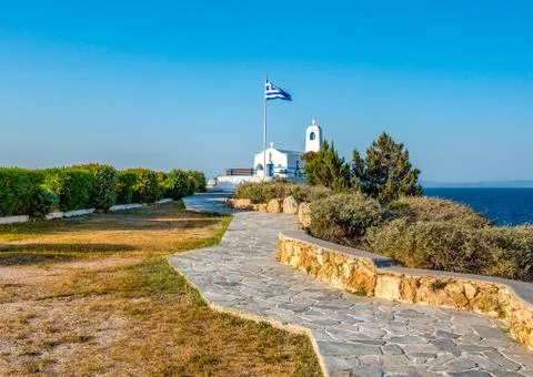 A  white small orthodox chapel dedicated to St.Nikolaos. Rafina,Greece Stock Photos