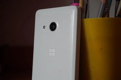 A white smartphone on the table Stock Photos