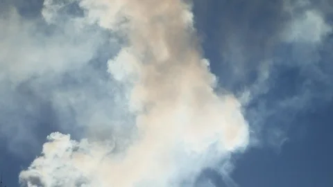 White smoke against a cloud blue sky sunlight landscape nature Stock Footage 70762525