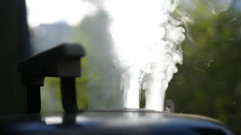 White smoke billowing out of BBQ close up Stock Footage