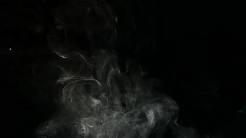 White smoke on a black background appears from the darkness. Stock Footage 199590955