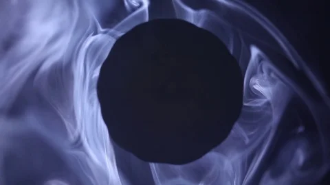 White smoke with black rotation core like abstract black sun Stock Footage 70824549
