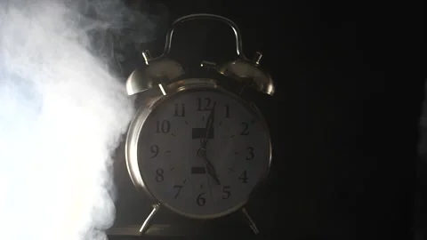 White smoke blowing towards Bell alarm clock ringing Stock Footage 206576842