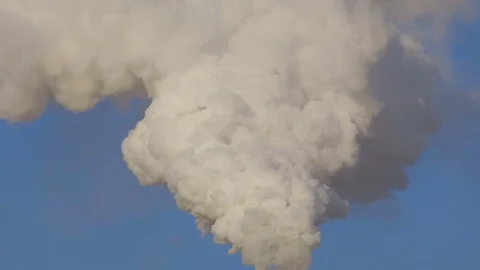 White smoke on a blue sky, abstraction. Global warming Stock Footage 84148883