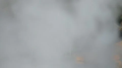 White smoke from burning waste covers the frame Stock Footage 306760089
