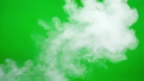 White smoke cloud against a vibrant green background Stock Footage 323580622