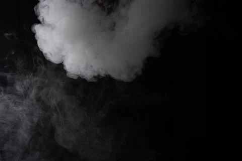 White smoke cloud on a black background, abstract texture of vapor or fog 스톡 사진