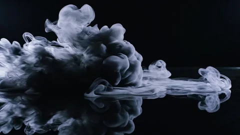 White Smoke Cloud Explosion on Black Reflective Surface Stock Footage 345678908