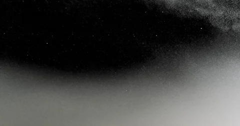 White smoke cloud slowly moving down, on the right side floating dust particles Stock Footage 115249109