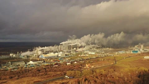 White smoke comes out of a large number of tall chimneys of chemical plants Stock Footage 165145149
