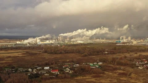 White smoke comes out of a large number of tall chimneys of chemical plants Stock Footage 165757604