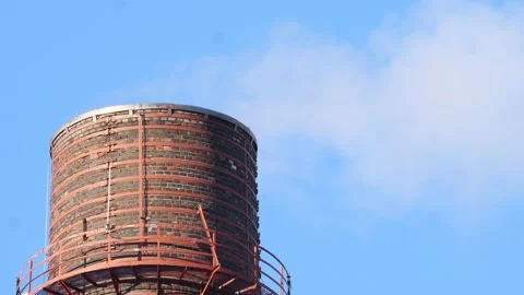 White smoke comes in slow motion from a brick factory chimney Stock Footage 234549783