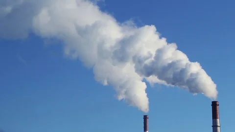 White smoke comes from two tubes against the blue sky Stock Footage 70377358