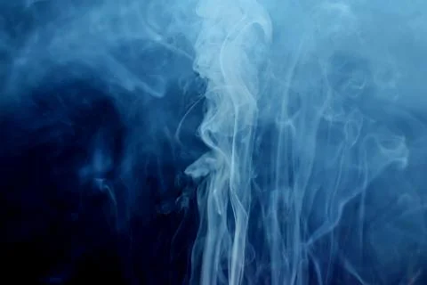 White smoke on dark background Stock Photos
