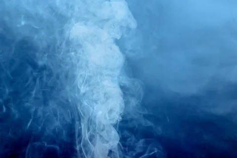 White smoke on dark background Stock Photos
