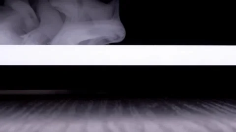 White Smoke Drifting Over Glowing Edge Against Pitch Black Vídeos de archivo 330115616