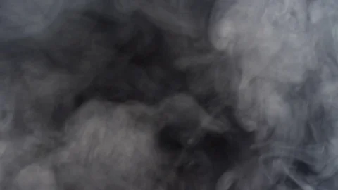 White smoke floating slowly in space on black background, 4k Stock Footage 76933373