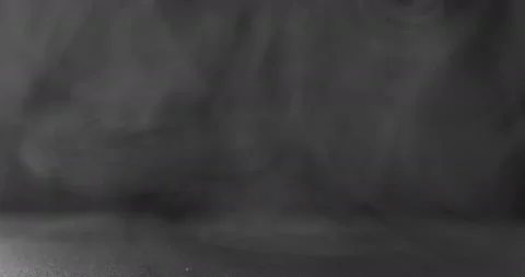 White smoke floating through space against black background Stock Footage 100243263