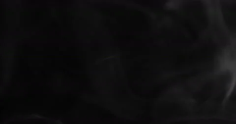 White smoke floating through space against black background Stock Footage 128892730