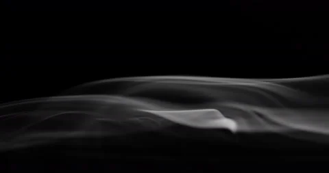 White smoke floating through space against black background Stock Footage 129315058