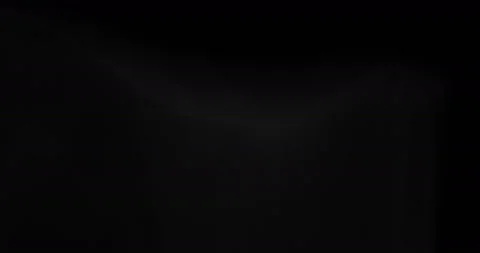 White smoke floating through space against black background Stock Footage 129975938