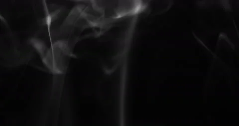 White smoke floating through space against black background Stock Footage 130358013