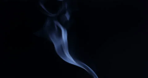 White smoke floating through space against black background Stock Footage 130363538