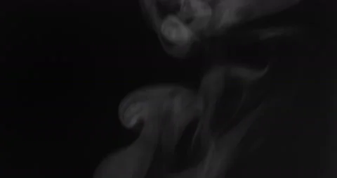 White smoke floating through space against black background Stock Footage 130363910