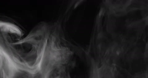 White smoke floating through space against black background Stock Footage 130991976