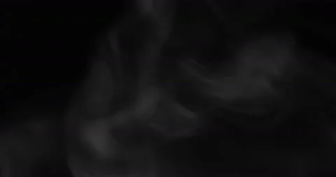 White smoke floating through space against black background Stock Footage 130995900