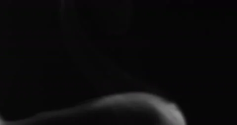 White smoke floating through space against black background Stock Footage 131007876