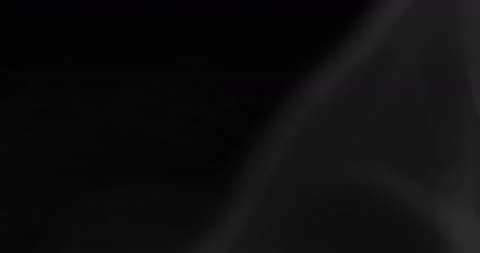 White smoke floating through space against black background Stock Footage 131008282