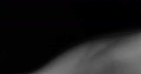 White smoke floating through space against black background Stock Footage 131009561