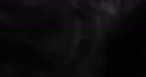 White smoke floating through space against black background Stock Footage 131340743