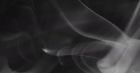 White smoke floating through space against black background Stock Footage 140211211
