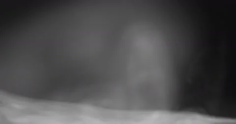 White smoke floating through space against black background Stock Footage 141881571