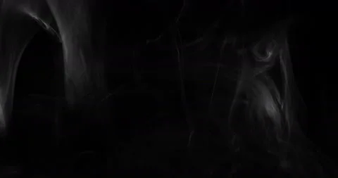 White smoke floating through space against black background Stock Footage 145179399