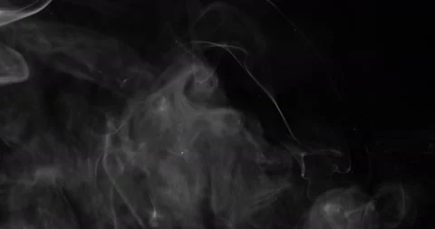 White smoke floating through space against black background Video stock 145415318