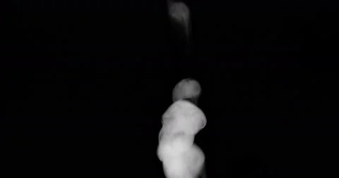 White smoke floating through space against black background Video stock 148880405