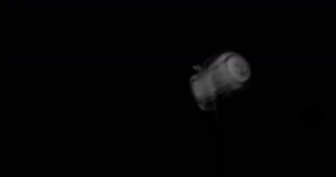 White smoke floating through space against black background Stock Footage 148880531
