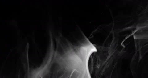 White smoke floating through space against black background Stock Footage 151565294