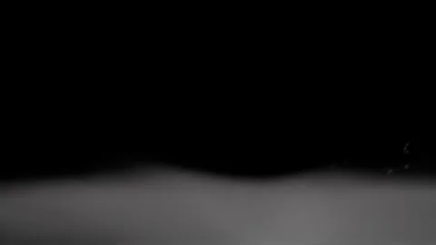White smoke floats along the bottom of the frame and fades away slowly. Stock-Footage 337454889