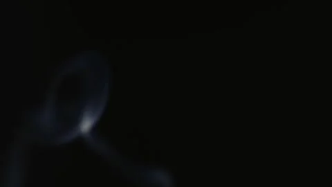 White smoke flutters thinly on a black background. Stock Footage 277433279