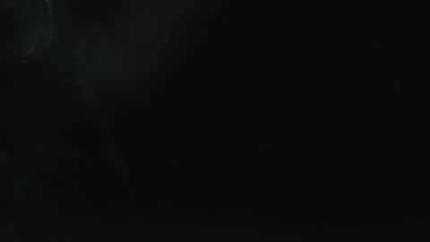 White smoke flutters thinly on a black background. Stock Footage 277433285