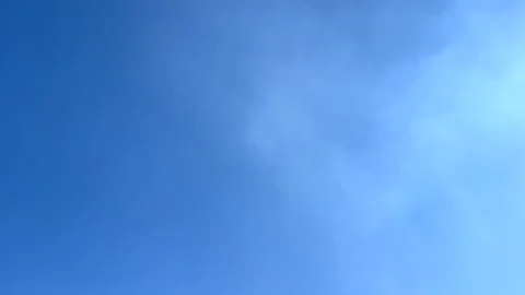 White smoke forming in the blue sky Stock Footage 312698255
