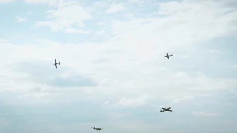 A white smoke loop pattern created by an aerobatic airplane in a clear blue sky Stock Footage 340394289