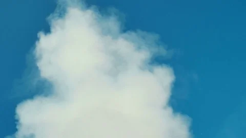 White smoke or cloud on clean blue sky. Ideally for background. Abstract concept Stock Footage 72743619