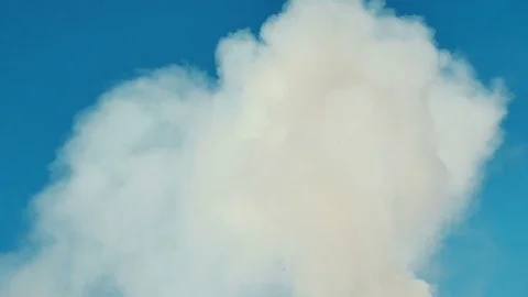 White smoke or cloud on clean blue sky. Ideally for background. Abstract concept Stock Footage 72744332