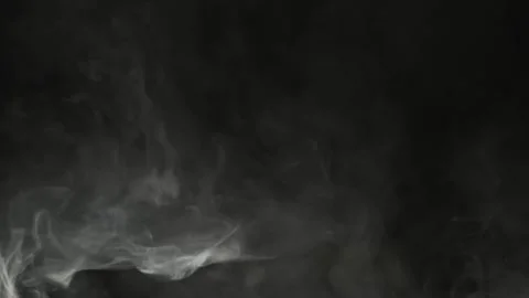 White smoke or steam streams in clouds on dark background 動画素材 304742382