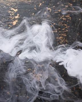 White smoke overlay on dark background Photos